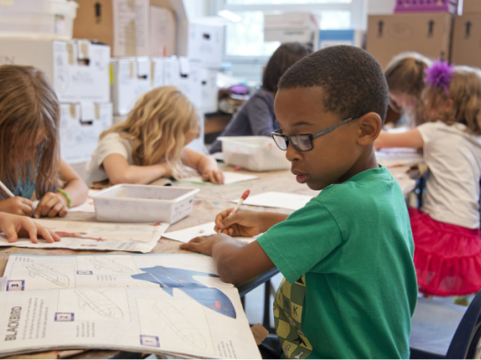 group of children in a classroom working