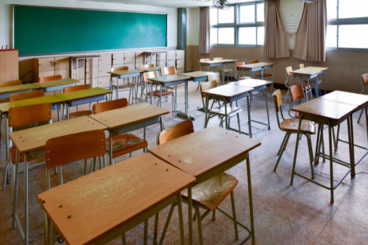 Empty classroom full of desks