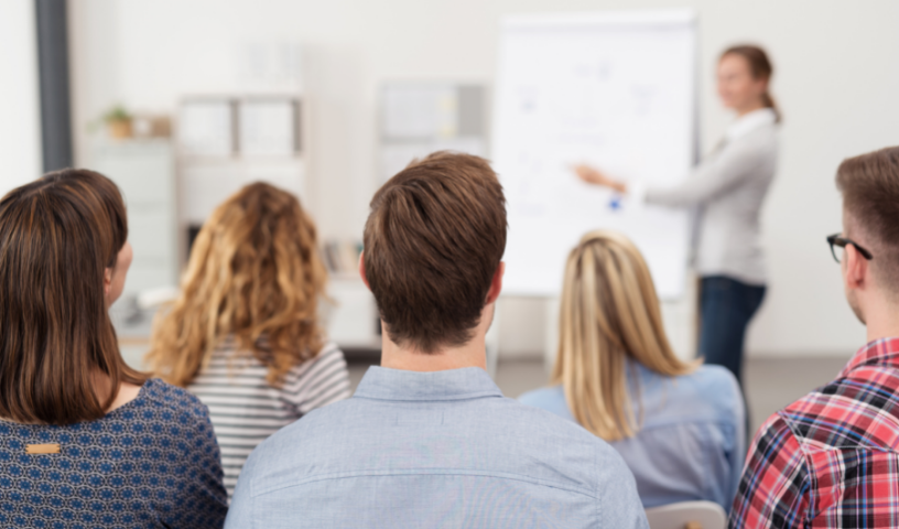Woman presenting to adults at a training day