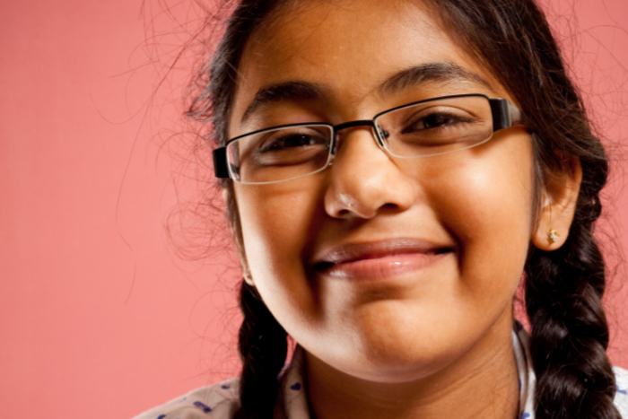 Close up of school pupil smiling at camera