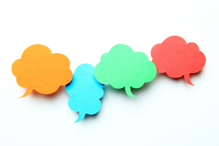 Photo of colourful post-its in shape of speech bubbles